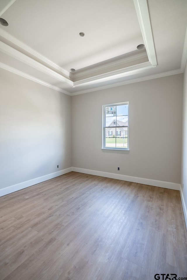 529 Eland Way, Bullard, TX 75757 - spare room with a raised ceiling, wood finished floors, and crown molding