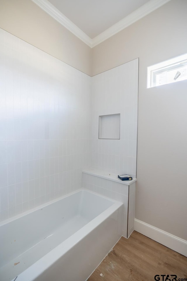 529 Eland Way, Bullard, TX 75757 - bathroom with wood finished floors, crown molding, and a tub