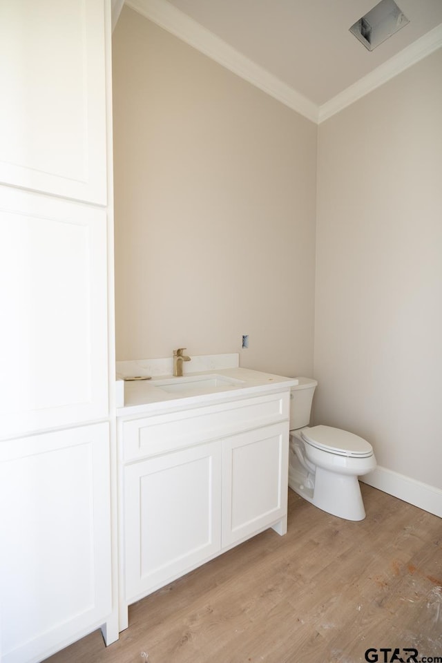 529 Eland Way, Bullard, TX 75757 - half bathroom featuring ornamental molding, vanity, and wood finished floors