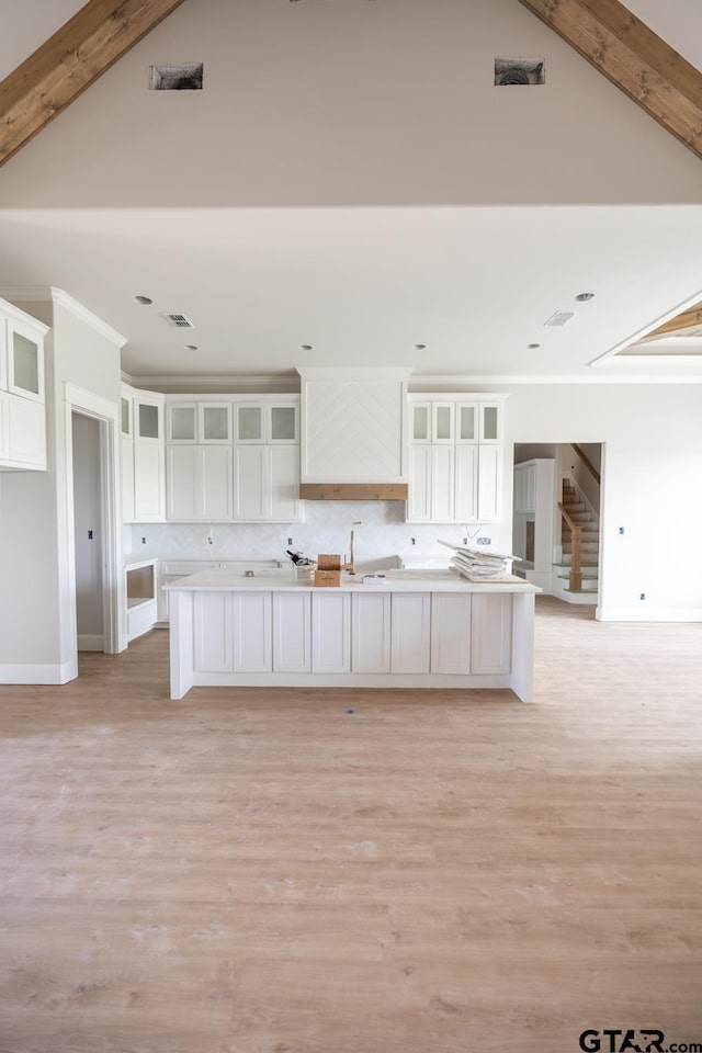 529 Eland Way, Bullard, TX 75757 - kitchen featuring white cabinetry, backsplash, and light wood finished floors
