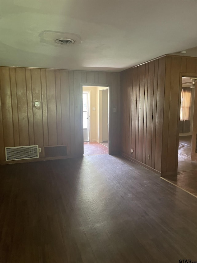 2800 Tanglewood, Tyler, TX 75703 - unfurnished room featuring wood finished floors and wood walls