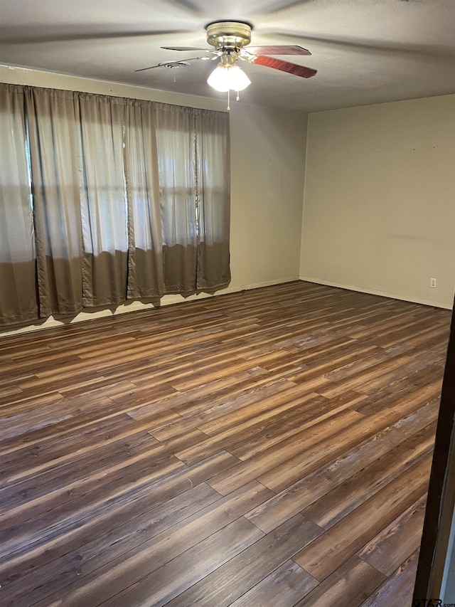 2800 Tanglewood, Tyler, TX 75703 - unfurnished room featuring ceiling fan and dark wood finished floors