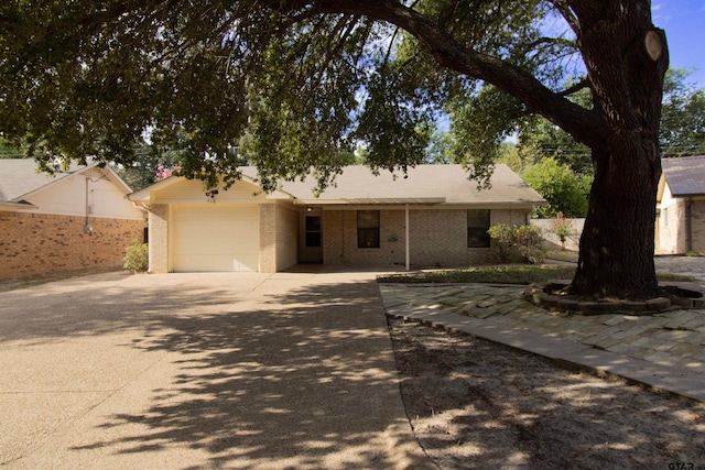 ranch-style home featuring a garage