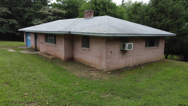 2035 Fm 69, Quitman, TX 75783 - view of side of home with a chimney, a lawn, and brick siding