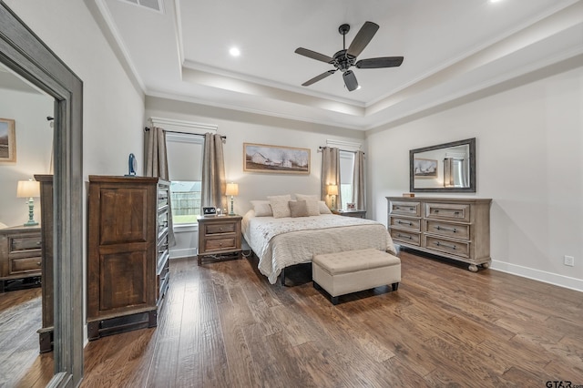 7306 Tule Creek Ln, Tyler, TX 75703 - bedroom with a tray ceiling, dark wood-type flooring, ornamental molding, recessed lighting, and a ceiling fan