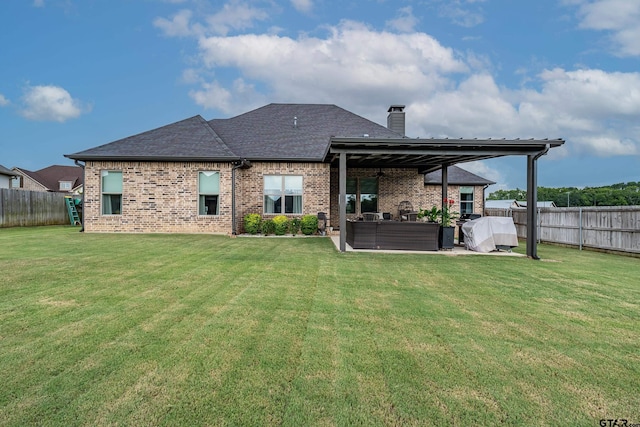 7306 Tule Creek Ln, Tyler, TX 75703 - rear view of property featuring a fenced backyard, a chimney, brick siding, and a hot tub