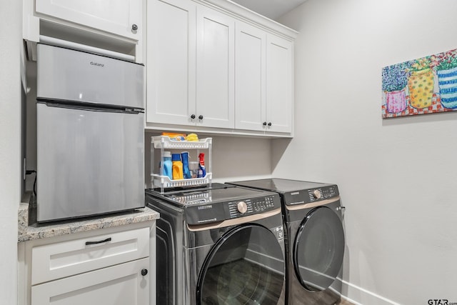 7306 Tule Creek Ln, Tyler, TX 75703 - laundry area featuring washing machine and clothes dryer and cabinet space