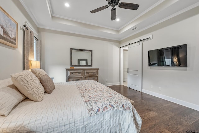 7306 Tule Creek Ln, Tyler, TX 75703 - bedroom with a barn door, dark wood-type flooring, a tray ceiling, ornamental molding, and recessed lighting
