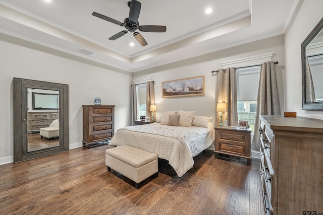 7306 Tule Creek Ln, Tyler, TX 75703 - bedroom featuring a tray ceiling, ornamental molding, dark wood finished floors, recessed lighting, and ceiling fan