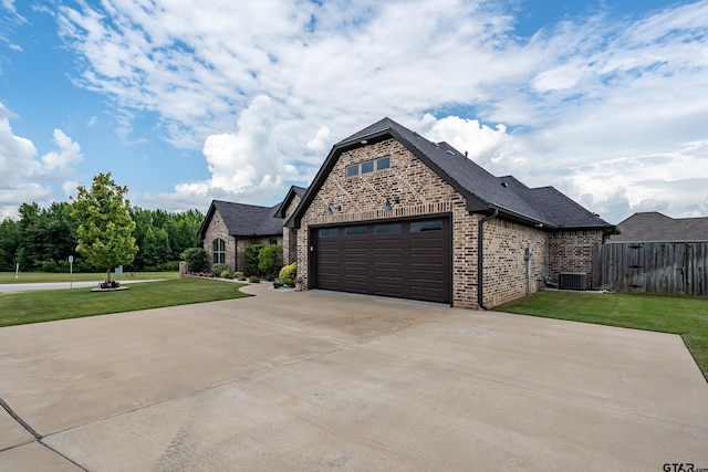 7306 Tule Creek Ln, Tyler, TX 75703 - french provincial home featuring brick siding, concrete driveway, and roof with shingles