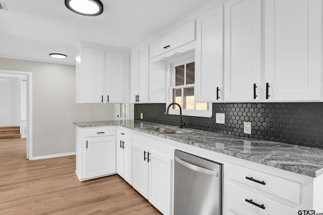 kitchen featuring white cabinetry, dishwasher, light hardwood / wood-style flooring, and sink