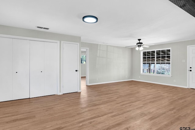 interior space with ceiling fan and light wood-type flooring