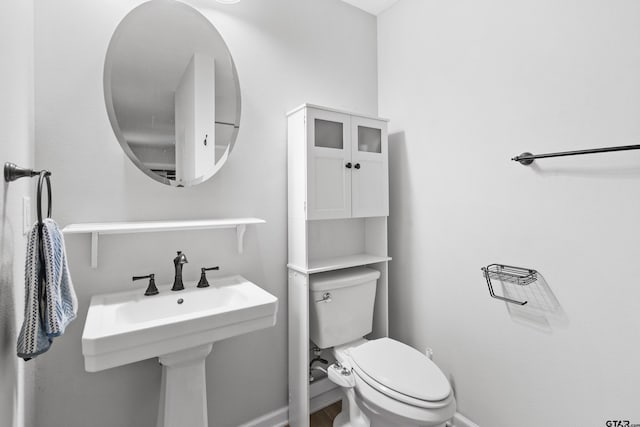 321 Inwood, Bullard, TX 75757 - bathroom featuring toilet, baseboards, and a sink