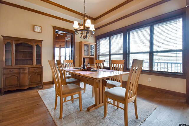 1860 Holcomb Cir, Tyler, TX 75703 - dining space with a wealth of natural light, light wood-style flooring, and ornamental molding