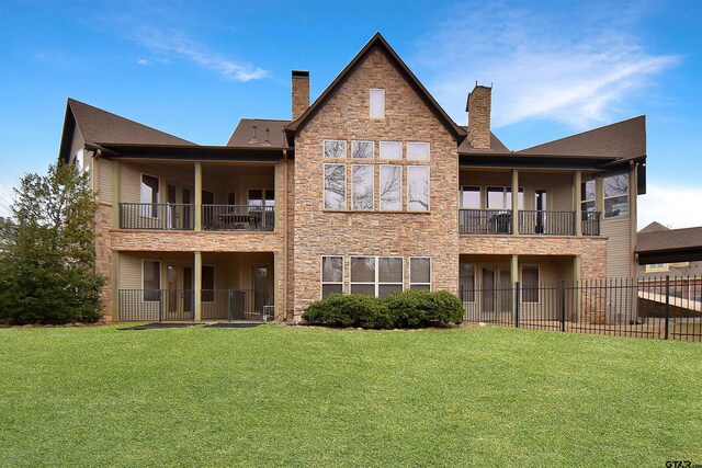 1860 Holcomb Cir, Tyler, TX 75703 - rear view of house featuring a lawn, fence, and a chimney
