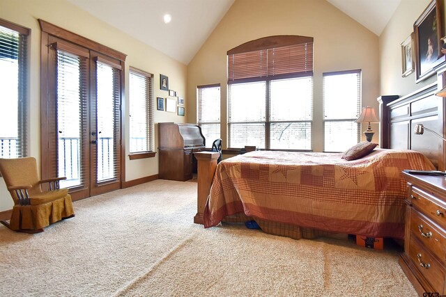 1860 Holcomb Cir, Tyler, TX 75703 - bedroom featuring light colored carpet, french doors, and high vaulted ceiling