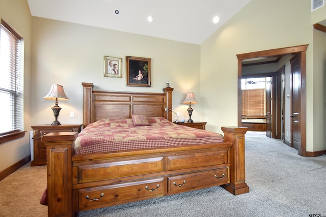 1860 Holcomb Cir, Tyler, TX 75703 - bedroom with light carpet, multiple windows, baseboards, and vaulted ceiling