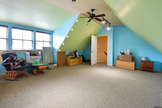 1860 Holcomb Cir, Tyler, TX 75703 - recreation room featuring lofted ceiling, carpet, rail lighting, baseboards, and ceiling fan