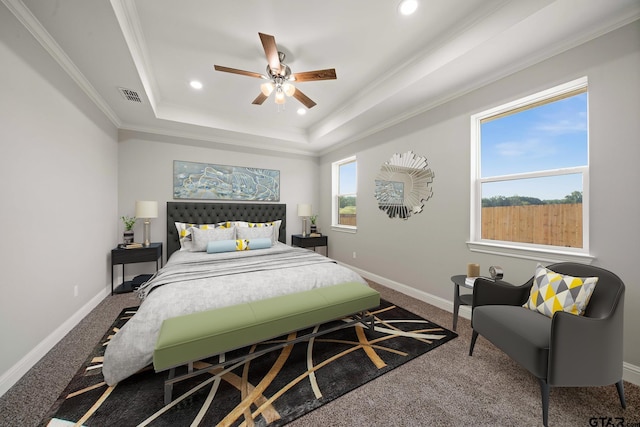 carpeted bedroom with crown molding, recessed lighting, a tray ceiling, and visible vents