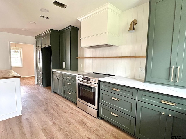 kitchen featuring electric range, green cabinetry, custom exhaust hood, and open shelves