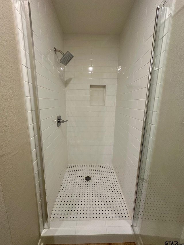 bathroom featuring a shower stall