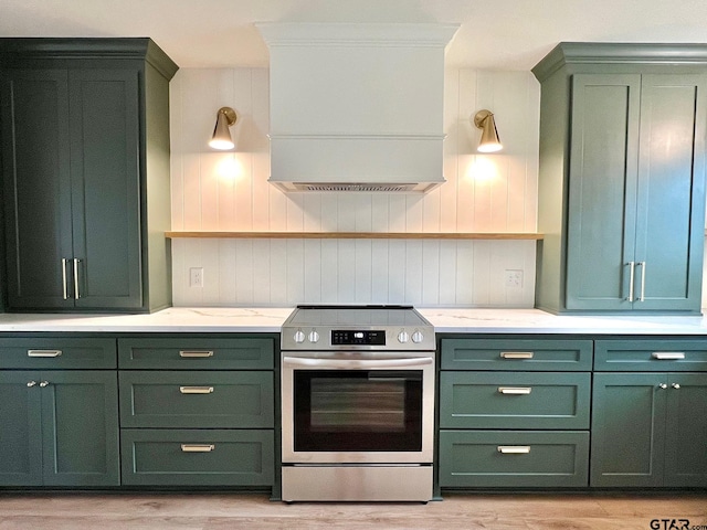 kitchen featuring stainless steel electric stove, green cabinetry, open shelves, and custom range hood