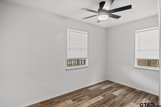 unfurnished room featuring a textured ceiling, dark hardwood / wood-style flooring, and ceiling fan