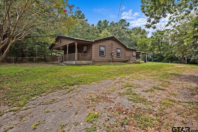 view of side of home featuring a yard