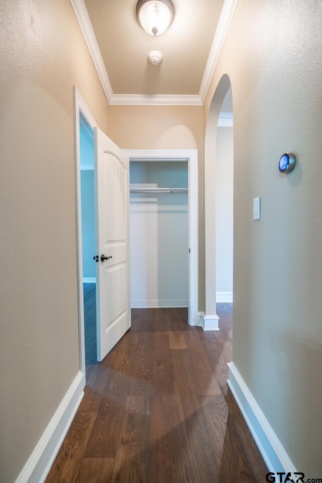 936 Cambridge Bnd, Tyler, TX 75703 - corridor featuring arched walkways, ornamental molding, wood finished floors, and baseboards