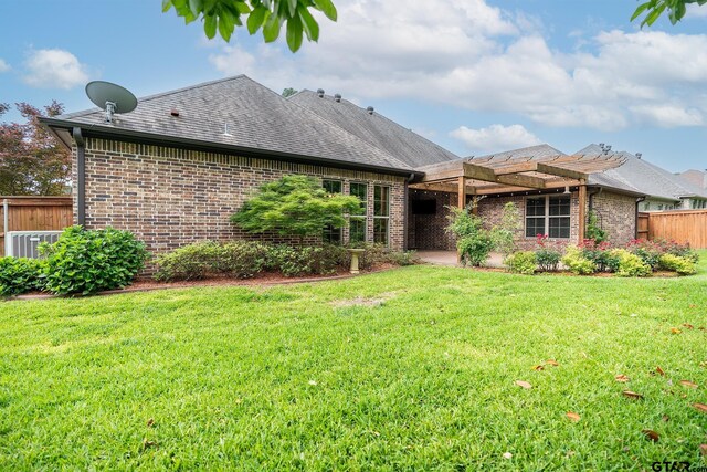 936 Cambridge Bnd, Tyler, TX 75703 - rear view of property featuring a pergola, brick siding, and a shingled roof
