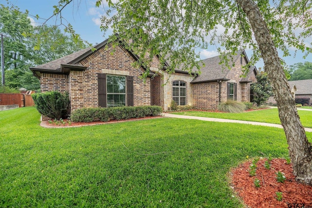 936 Cambridge Bnd, Tyler, TX 75703 - view of front of house featuring brick siding and a shingled roof