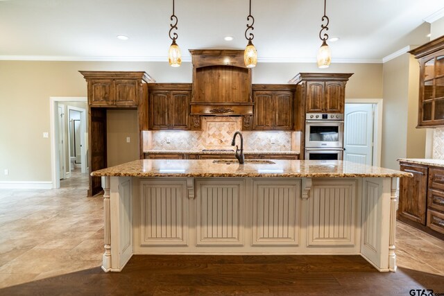 936 Cambridge Bnd, Tyler, TX 75703 - kitchen featuring a sink, stainless steel double oven, light stone counters, decorative backsplash, and crown molding