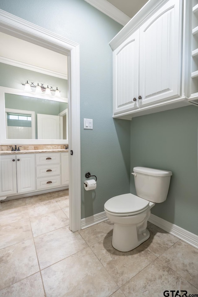 936 Cambridge Bnd, Tyler, TX 75703 - bathroom with toilet, tile patterned flooring, baseboards, and ornamental molding
