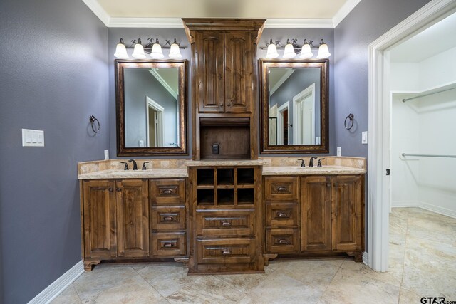 936 Cambridge Bnd, Tyler, TX 75703 - bathroom featuring crown molding, double vanity, and baseboards