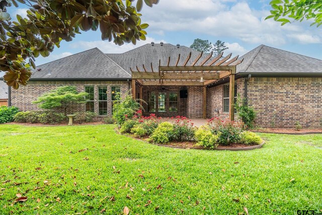 936 Cambridge Bnd, Tyler, TX 75703 - back of house with brick siding, a pergola, a patio area, and a yard