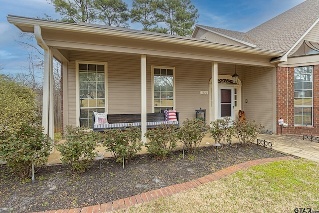 entrance to property with a porch