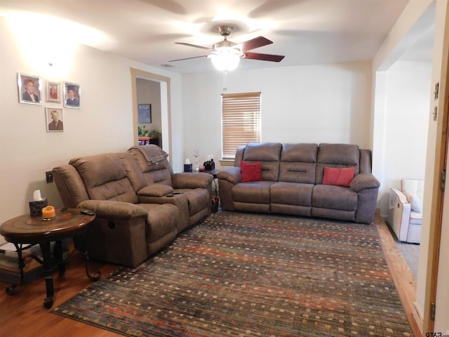 living area featuring ceiling fan and wood finished floors