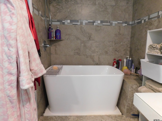 full bath featuring a freestanding bath