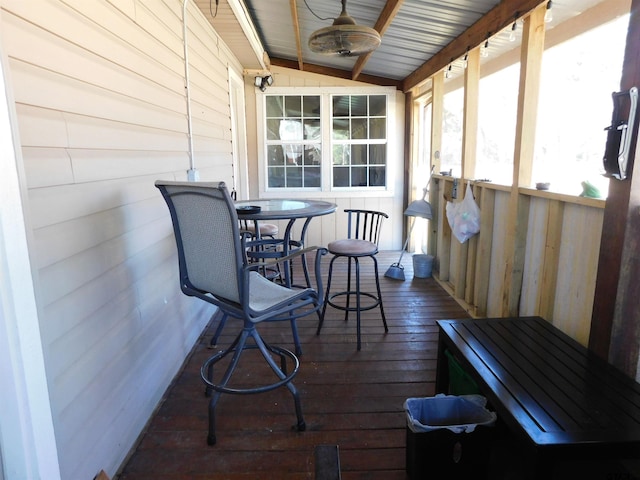 wooden terrace featuring a ceiling fan