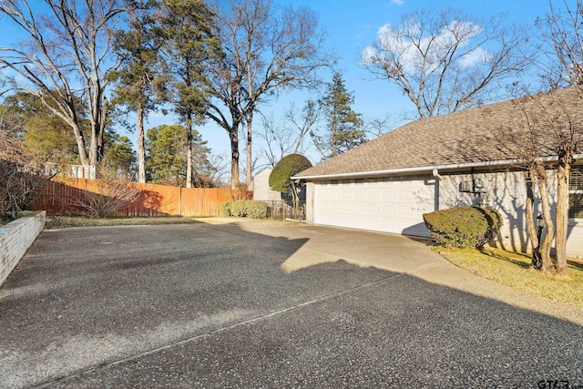 view of side of home with a garage