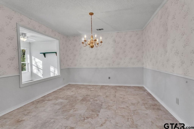 spare room featuring an inviting chandelier, ornamental molding, and a textured ceiling