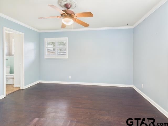3323 S Keaton Ave, Tyler, TX 75701 - empty room featuring crown molding, baseboards, and wood finished floors