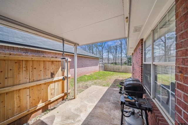 view of patio / terrace featuring fence