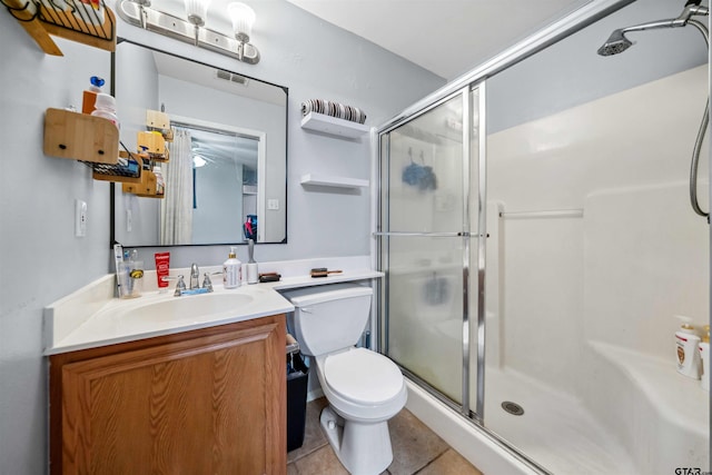 full bath featuring visible vents, toilet, a stall shower, and vanity