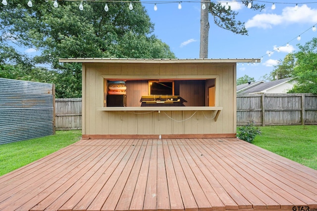 15479 Nell Lynn Ln, Tyler, TX 75707 - wooden deck featuring a fenced backyard and an outdoor structure