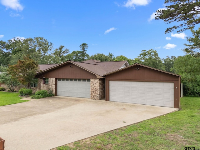 15479 Nell Lynn Ln, Tyler, TX 75707 - single story home featuring an attached garage, driveway, and a front yard