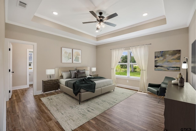 14524 Woodland Creek Dr, Tyler, TX 75706 - bedroom with a raised ceiling, wood finished floors, baseboards, crown molding, and recessed lighting