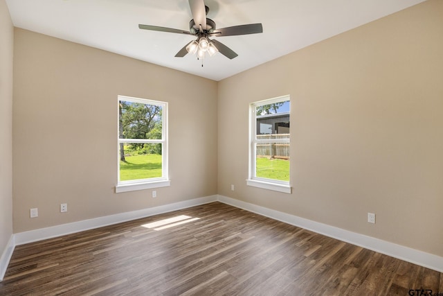 14524 Woodland Creek Dr, Tyler, TX 75706 - unfurnished room with dark wood-type flooring, baseboards, and ceiling fan