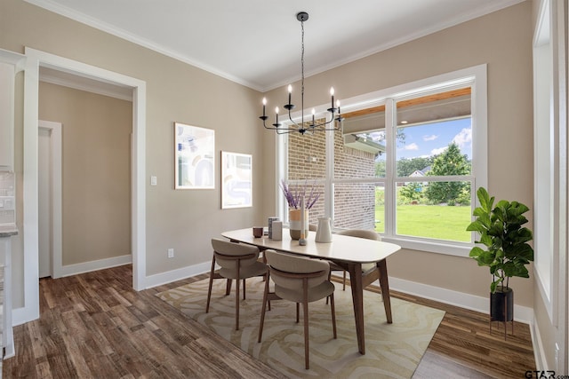 14524 Woodland Creek Dr, Tyler, TX 75706 - dining area with dark wood finished floors, baseboards, a chandelier, and ornamental molding