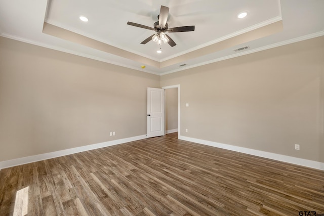 14524 Woodland Creek Dr, Tyler, TX 75706 - unfurnished room featuring a raised ceiling, wood finished floors, a ceiling fan, baseboards, and crown molding